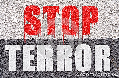 On the white-gray surface of the wall is the inscription - stop terror Stock Photo