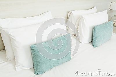 White and green pillows on bed Stock Photo