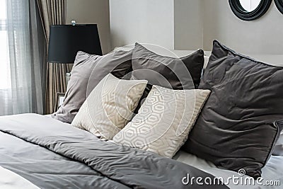 White and grey pillows on bed Stock Photo