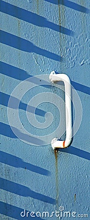 White Handle Blue Shadows Concrete Stock Photo