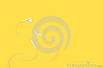 White headphones on a yellow background Stock Photo