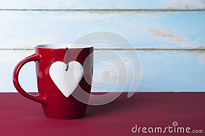 White heart with red mug. Valentines concept. Stock Photo