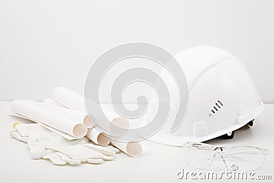 White helmet, gloves, plan, drawings, construction glasses on white background, construction concept Stock Photo