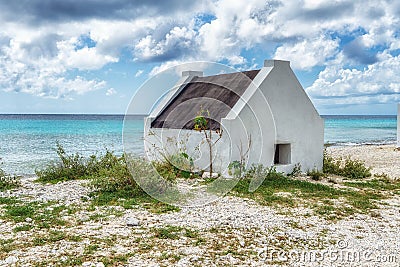 White historic slave houses on Bonaire tropical coastline Stock Photo