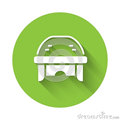 White Hockey helmet icon isolated with long shadow. Green circle button. Vector Stock Photo