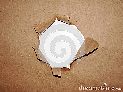 A hole in a package paper Stock Photo