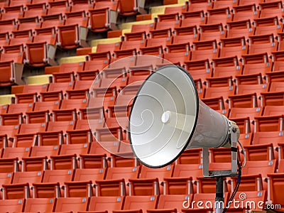 White horn speaker with stadium seat background Stock Photo