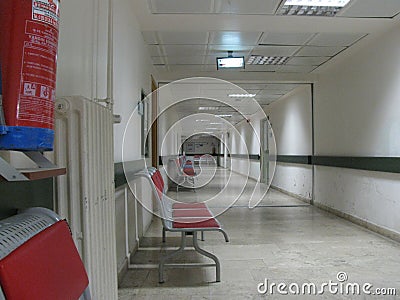 A White Hospital Corridor, Seats Around Editorial Stock Photo