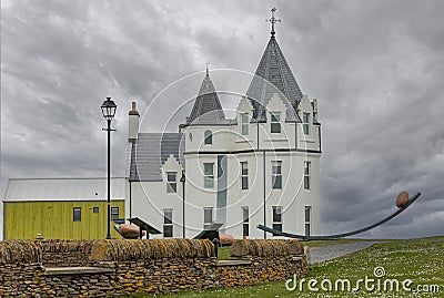 White hotel with pointed roof located at John O'Groats Editorial Stock Photo