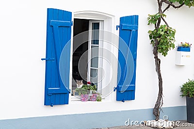 White house facade with blue shutter in Noirmoutier island vendee France Stock Photo