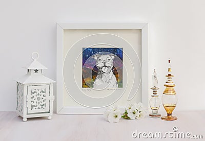 White interior display. Framed smiling Staffy dog collaged drawing. Stock Photo