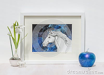 White interior display. Framed horses head painting, blue background. Stock Photo