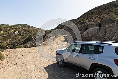 A white Jeep Renegade is parked on a dirt road. All wheel drive. Editorial Stock Photo