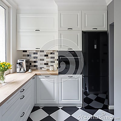 White kitchen with chess flooring Stock Photo