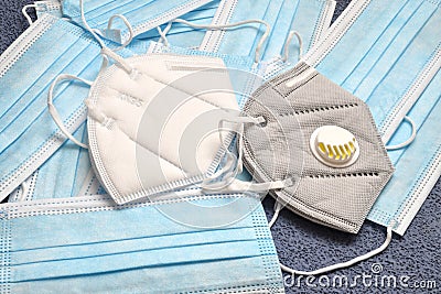 White KN95 or N95 mask with and without valve and antiviral medical mask for protection against coronavirus. Surgical protective Stock Photo