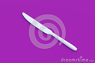 White knife on violet background Stock Photo