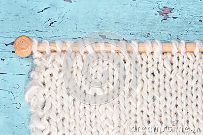 White knitting on rustic background Stock Photo