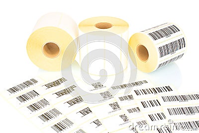 White label rolls and printed barcodes isolated on white background with shadow reflection. White reels of labels for printers. Stock Photo