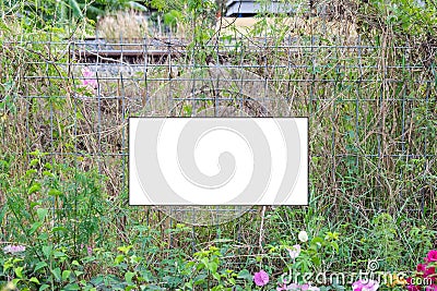 White label signs warning and wire fence Stock Photo