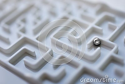 White labyrinth and metal ball, complex problem solving concept. Stock Photo