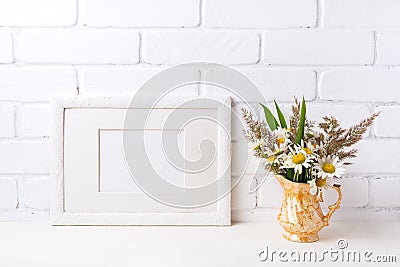 White landscape frame mockup with chamomile and grass in golden Stock Photo