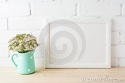 White landscape frame mockup with soft pink flowers in pitcher Stock Photo