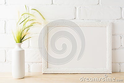 White landscape frame mockup with yellow and green wild grass ea Stock Photo