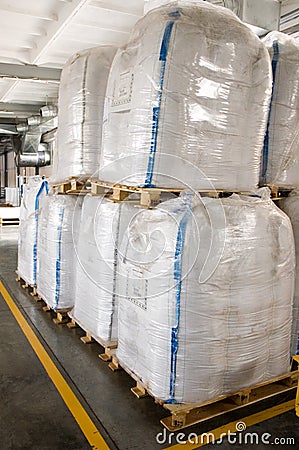 White large containers for bulk material on pallets Stock Photo