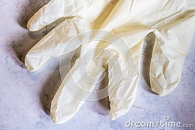 White latex glove, medical glove close-up, protective gloves during coronavirus pandemic - Image Stock Photo