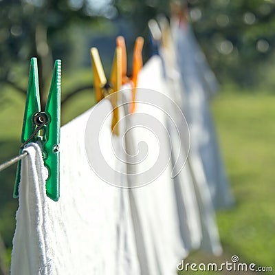 White laundry drying on a clothesline Stock Photo