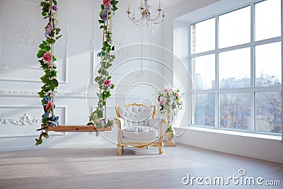 White leather vintage style chair in classical interior room with big window and spring flowers Stock Photo