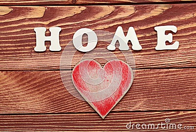 White letters with word HOME and heart on wooden background Stock Photo