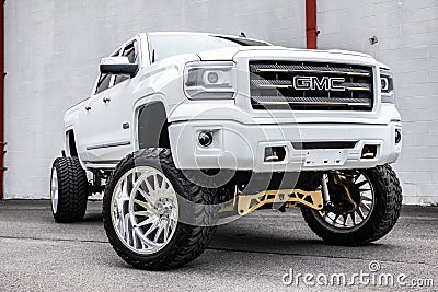 White lifted GMC truck parked outdoors Editorial Stock Photo