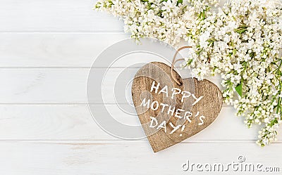 White lilac flowers wooden heart Mothers Day Stock Photo