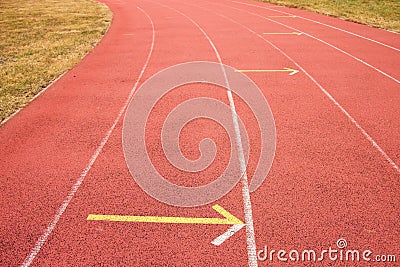 White lines and texture of running racetrack, red rubber racetracks in small stadium Stock Photo