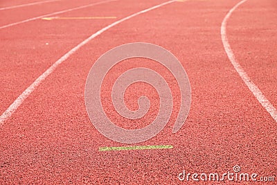 White lines and texture of running racetrack, red rubber racetracks in small stadium Stock Photo