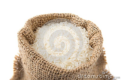 White long rice in small burlap sack on white backgroun Stock Photo