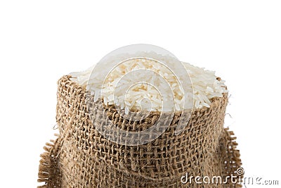 White long rice in small burlap sack on white backgroun Stock Photo