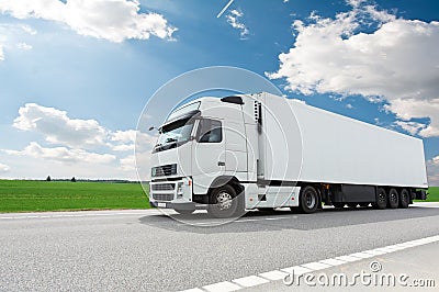 White lorry with trailer over blue sky Stock Photo