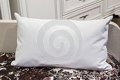 White lumbar pillow on a bed, case Mockup. Interior photo Stock Photo