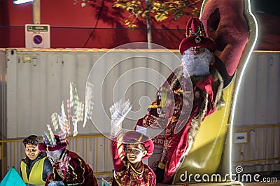 The white magician king, Melchor sitting on his throne in the parade Editorial Stock Photo