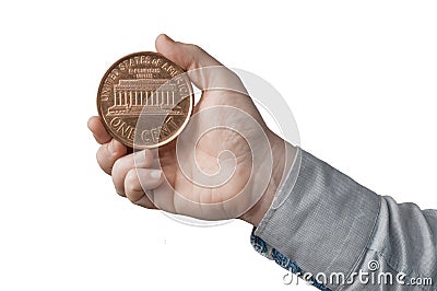 White man in blue shirt hold a big american penny one cent in his hand. on white background Stock Photo
