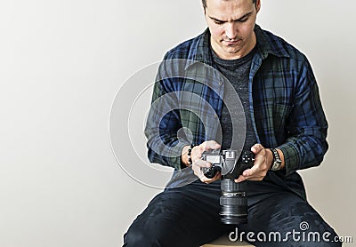 White man checking camera record Stock Photo