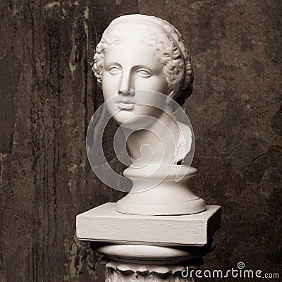 White marble head of young woman. Statue art sculpture of stone face. Ancient beautiful woman monument Stock Photo