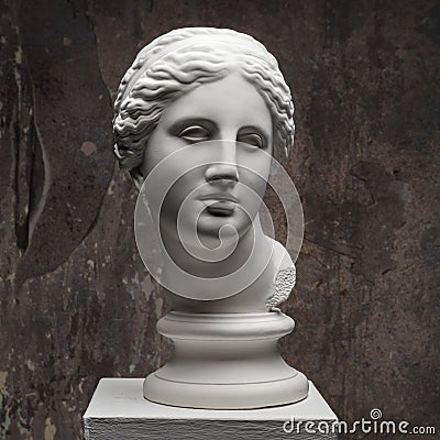 White marble head of young woman. Statue art sculpture of stone face. Ancient beautiful woman monument Stock Photo