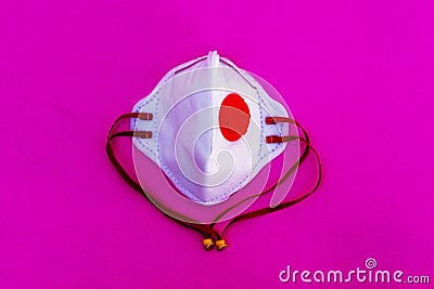 White medical mask isolated on pink background.Healthcare and medical concept Stock Photo