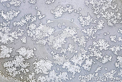 White melting frost on the frozen window glass in the cold winter day as natural background front view Stock Photo