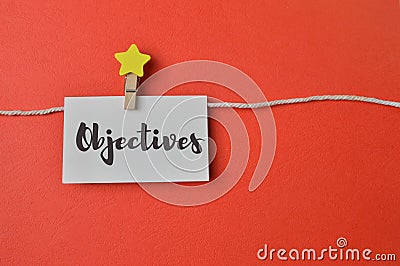 White memo note written with text OBJECTIVES Stock Photo