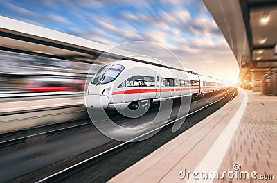 White modern high speed train in motion Stock Photo