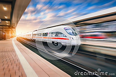 White modern high speed train in motion Stock Photo